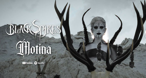 Arte del vídeo Zelvar de Black Spikes con una figura oscura y astas
